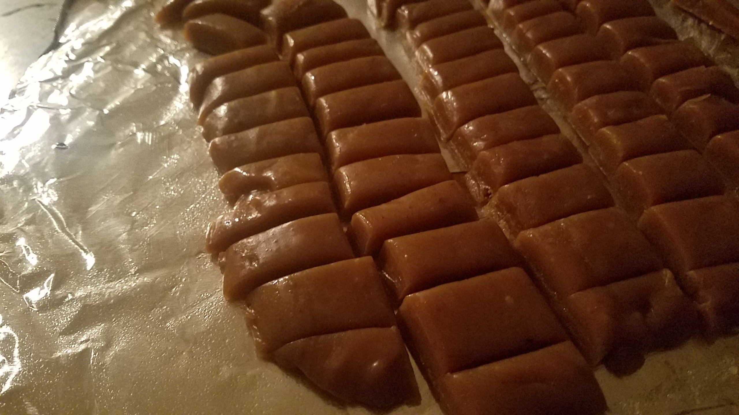 Caramels waiting to be wrapped in wax or plastic paper. 
