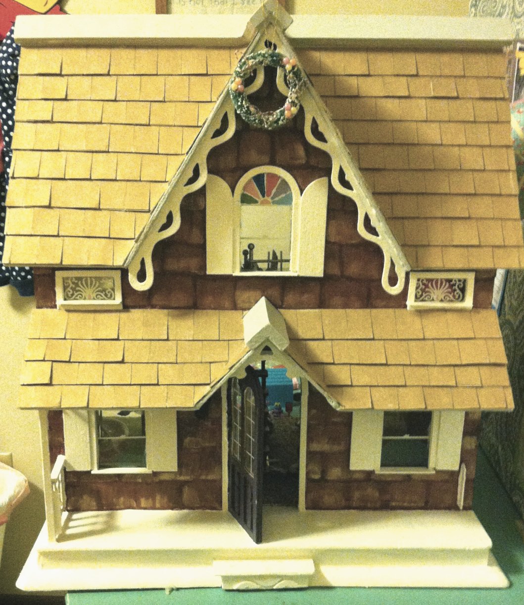 After picture of finished doll house renovation, complete with reinforced porch, foundation and roof top. 