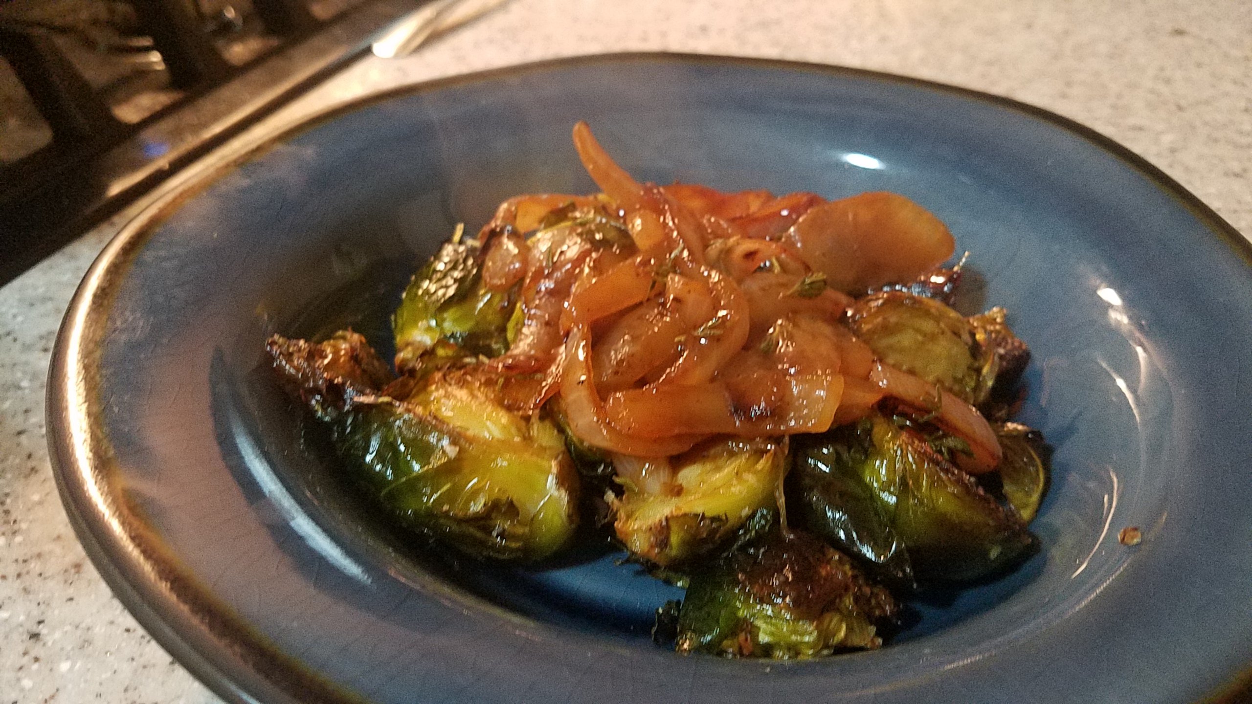 To add a fancy side to roasted Brussel Sprouts, add some tasty caramelized onions. 