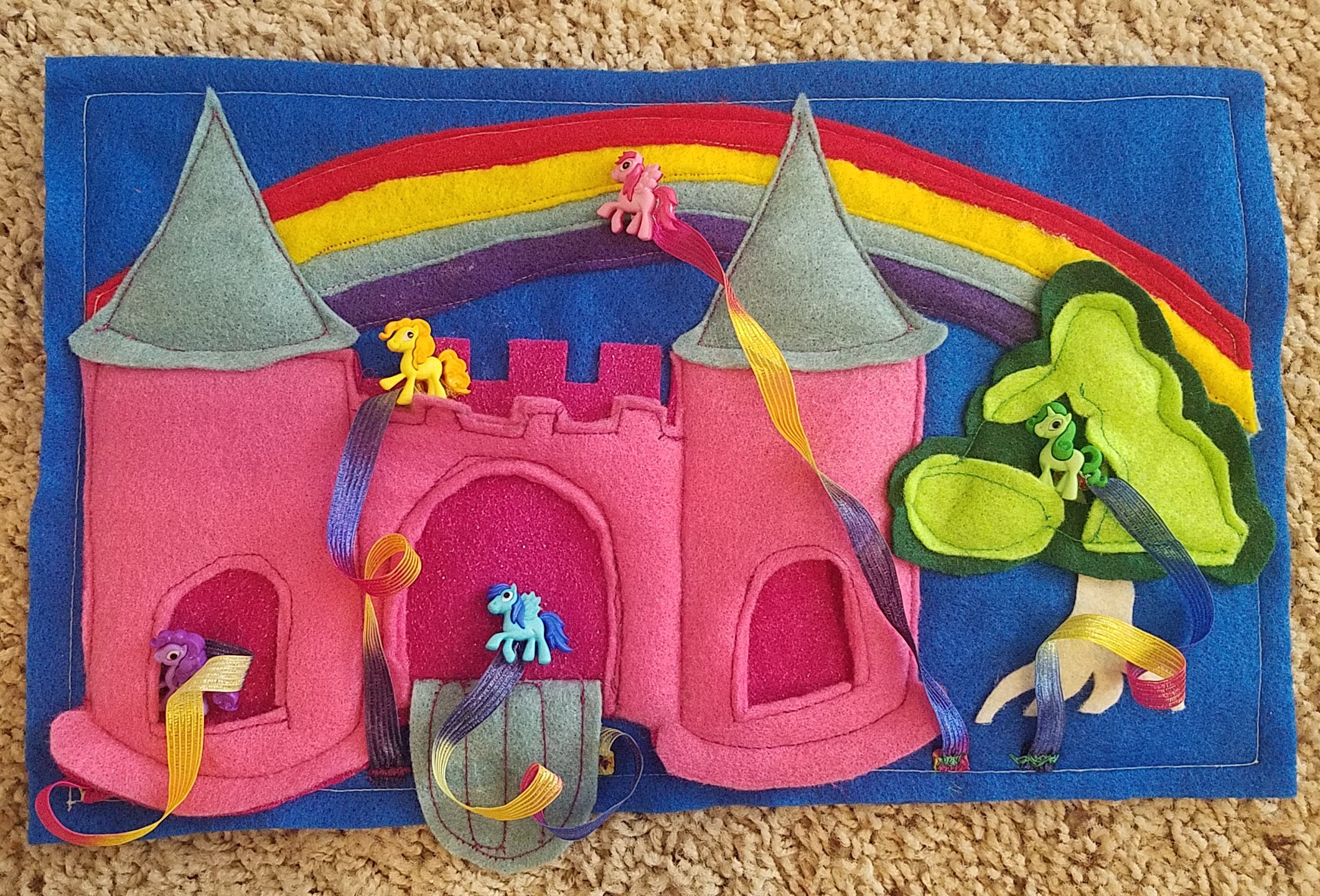 The My Little Pony Castle made from felt and character buttons. 