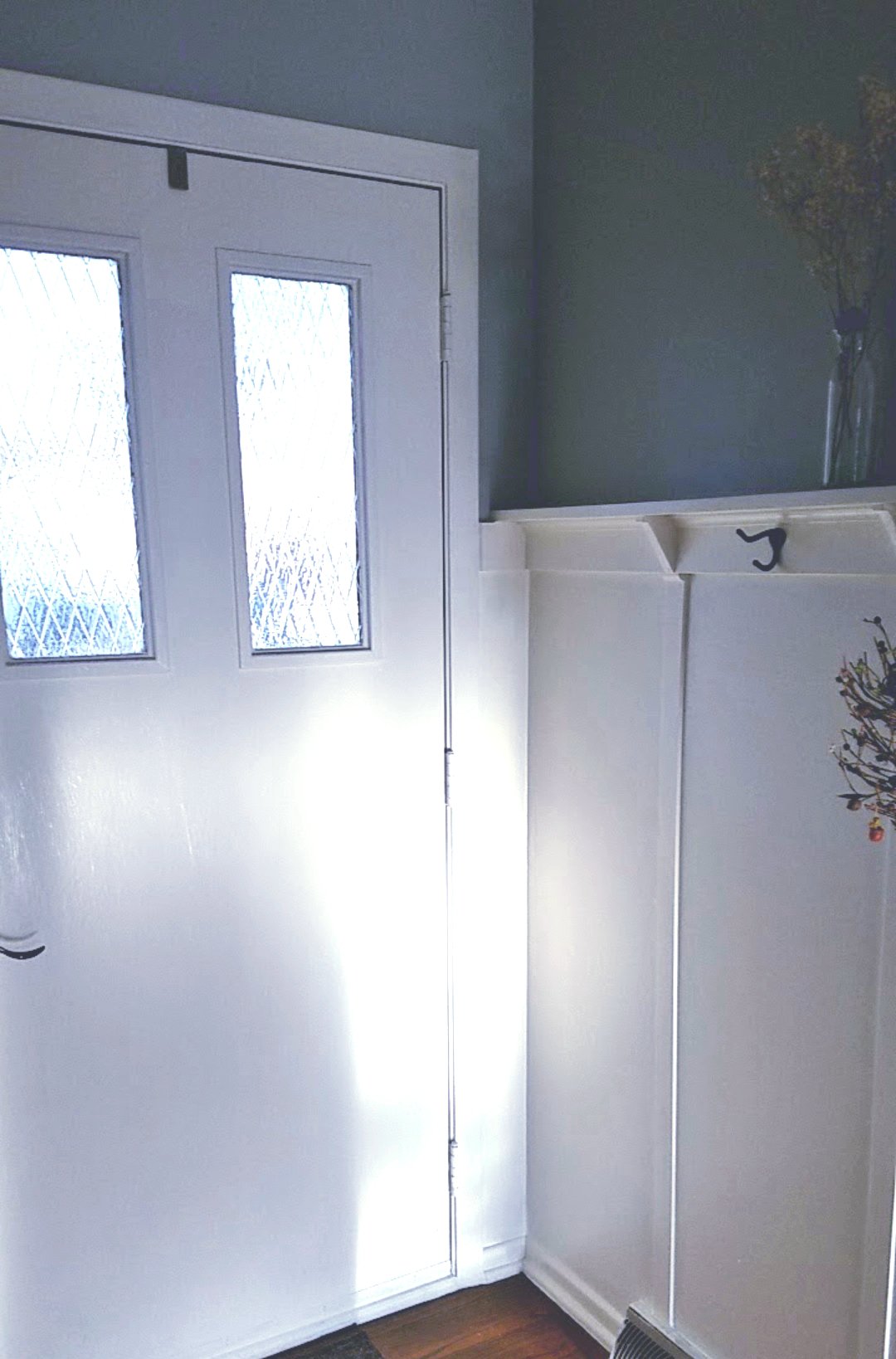 Light wainscoting on the bottom with a warm gray on top makes the room seem larger and causes you to look up. 