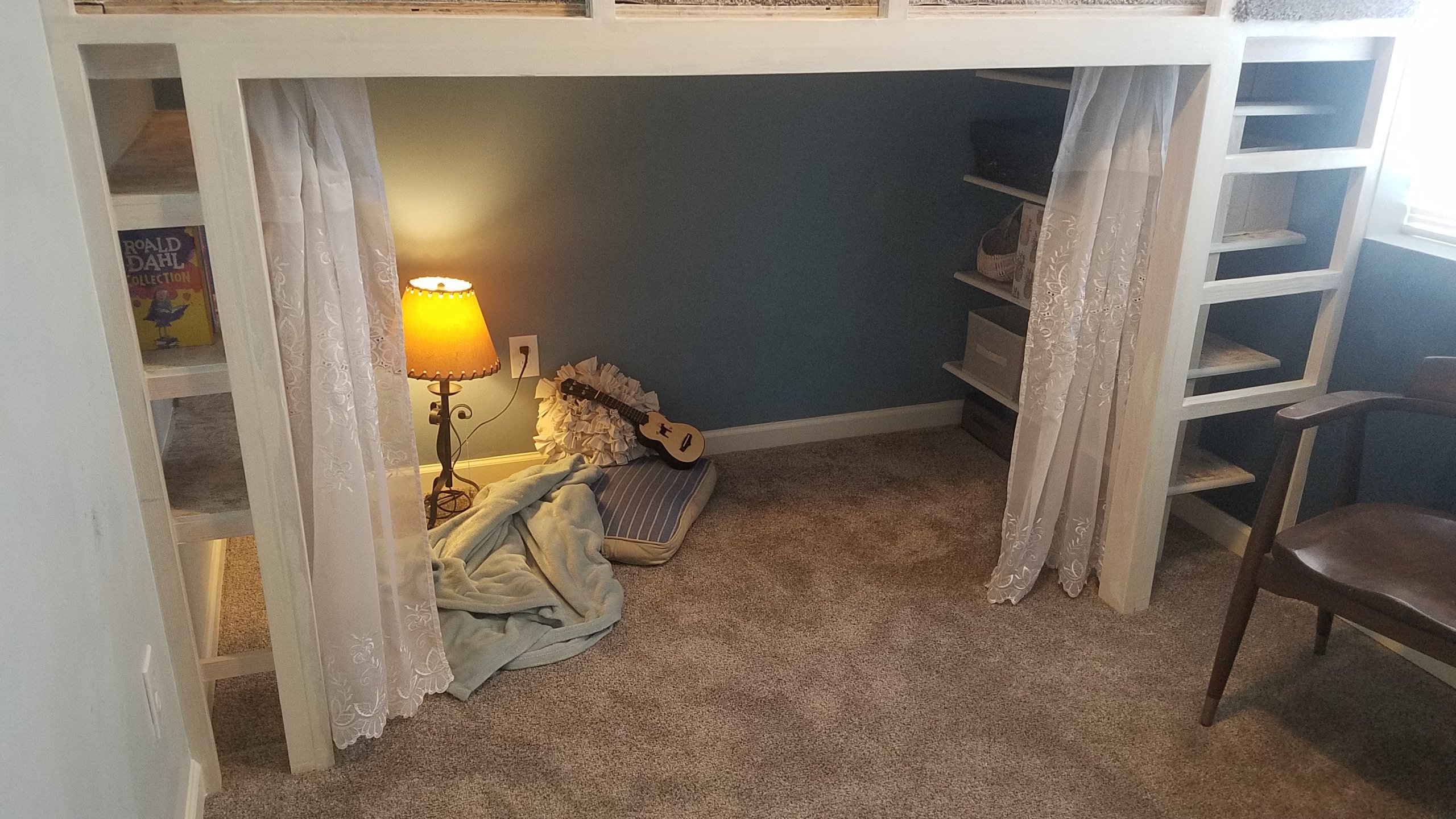 Pillows and blankets make for the perfect spot to cuddle up and read a book. 