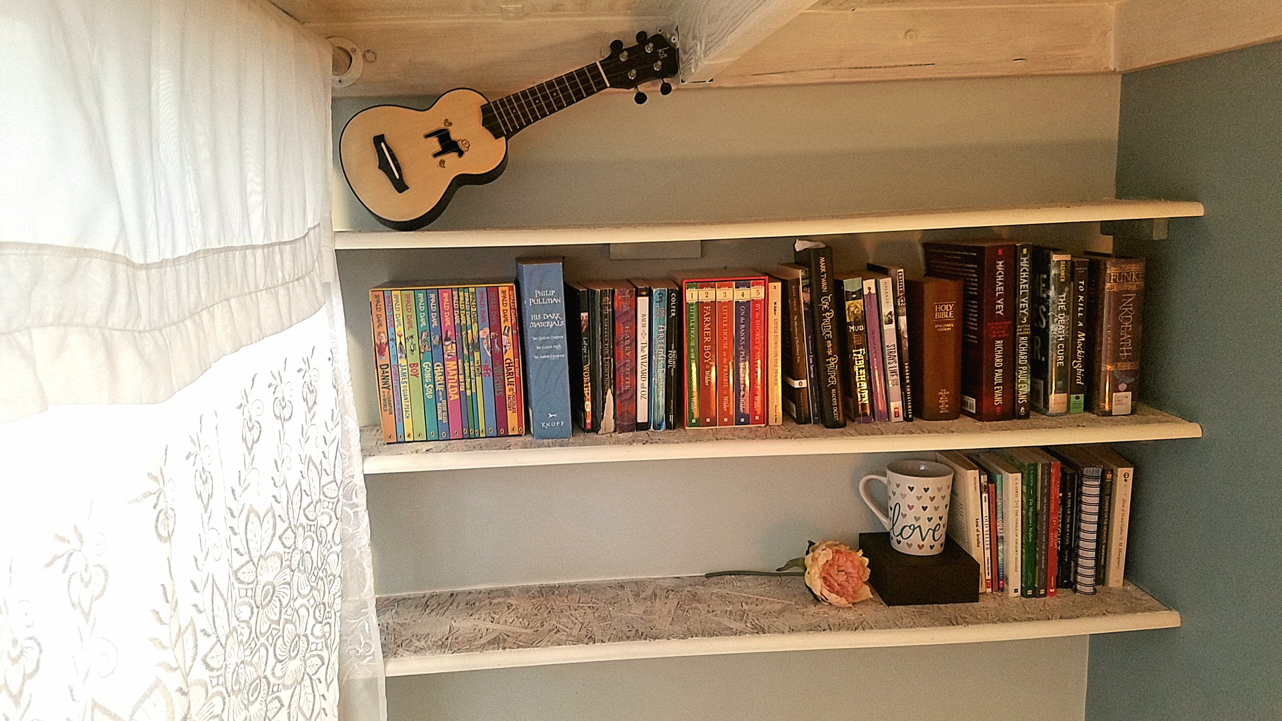 Never run out of reading material with a built in shelf right under the loft bed. 
