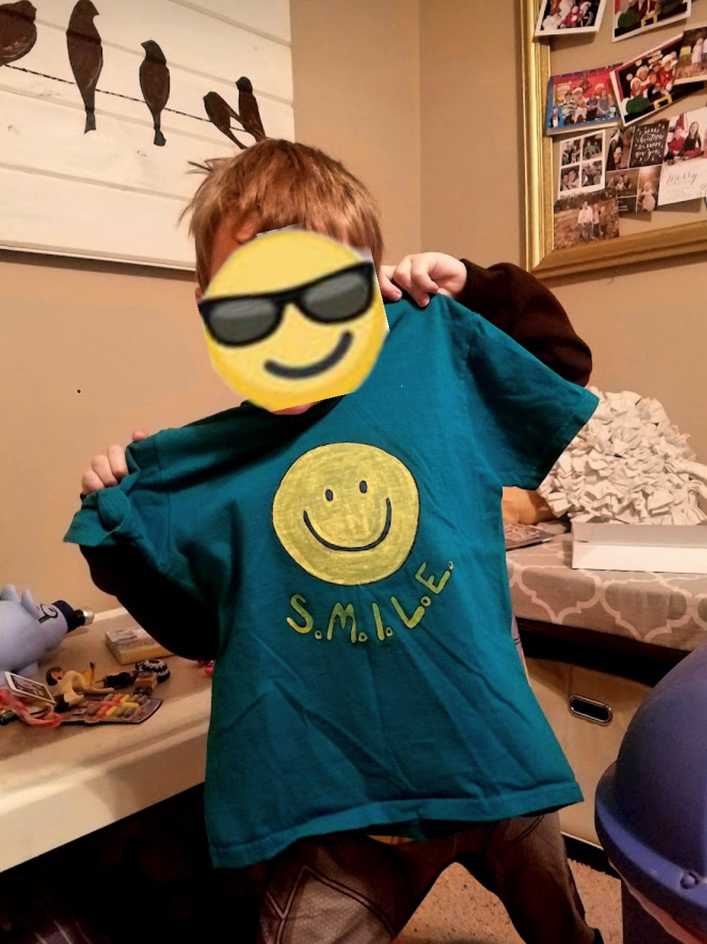 Smiley face T-shirt with a freezer paper stencil and toll paint. 
