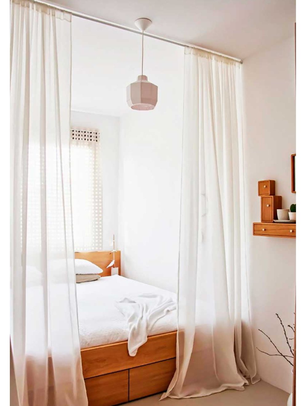 Create space with curtains that go to the ceiling. 